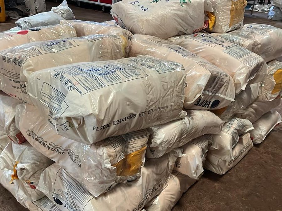 Stacked raw material sacks for packaging production